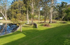 South Coast Site rentals: lake near trees surrounded by temporary fencing